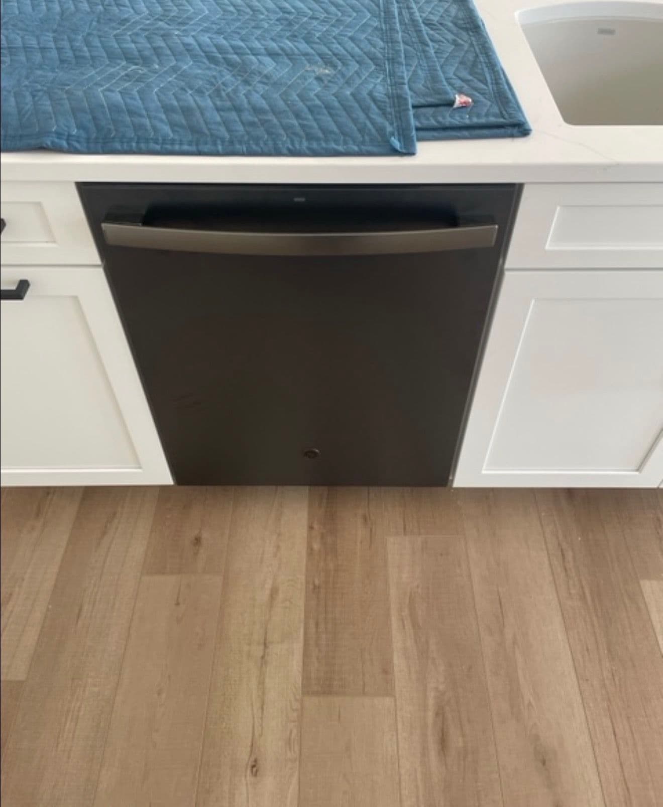 Matte Black Appliances Installed in a Fresh White Kitchen image