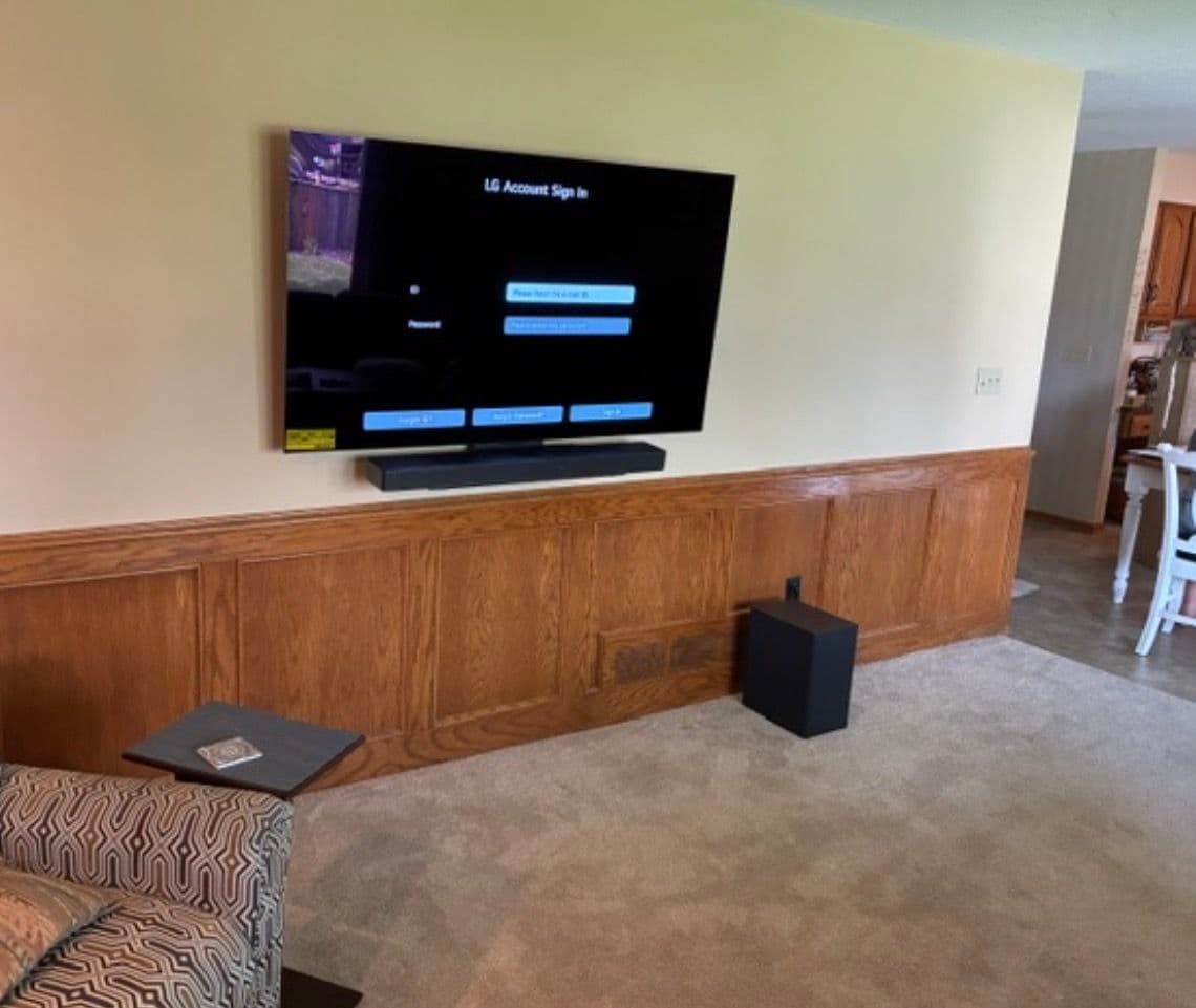 75-Inch TV and Sound Bar Mounted With a Clean, Finished Look image